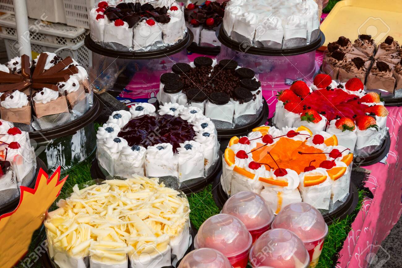 122532451-different-types-cake-tray-in-showcase-display-at-store-bakery-pastry-shop-sweets-chocolate-milk-and-.jpg