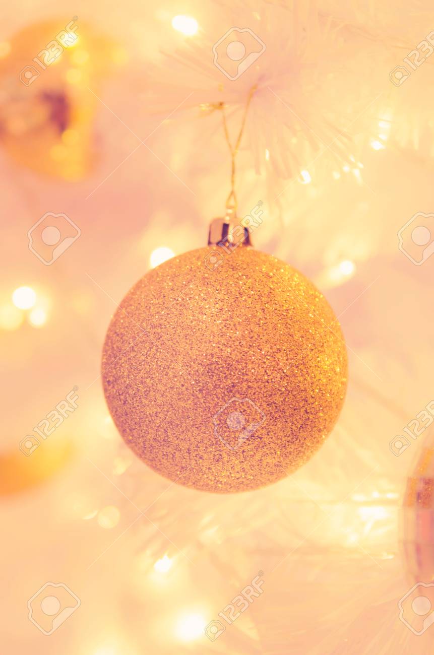 christmas ornaments gold ball and light bulb on christmas tree stock christmas tree bulb
