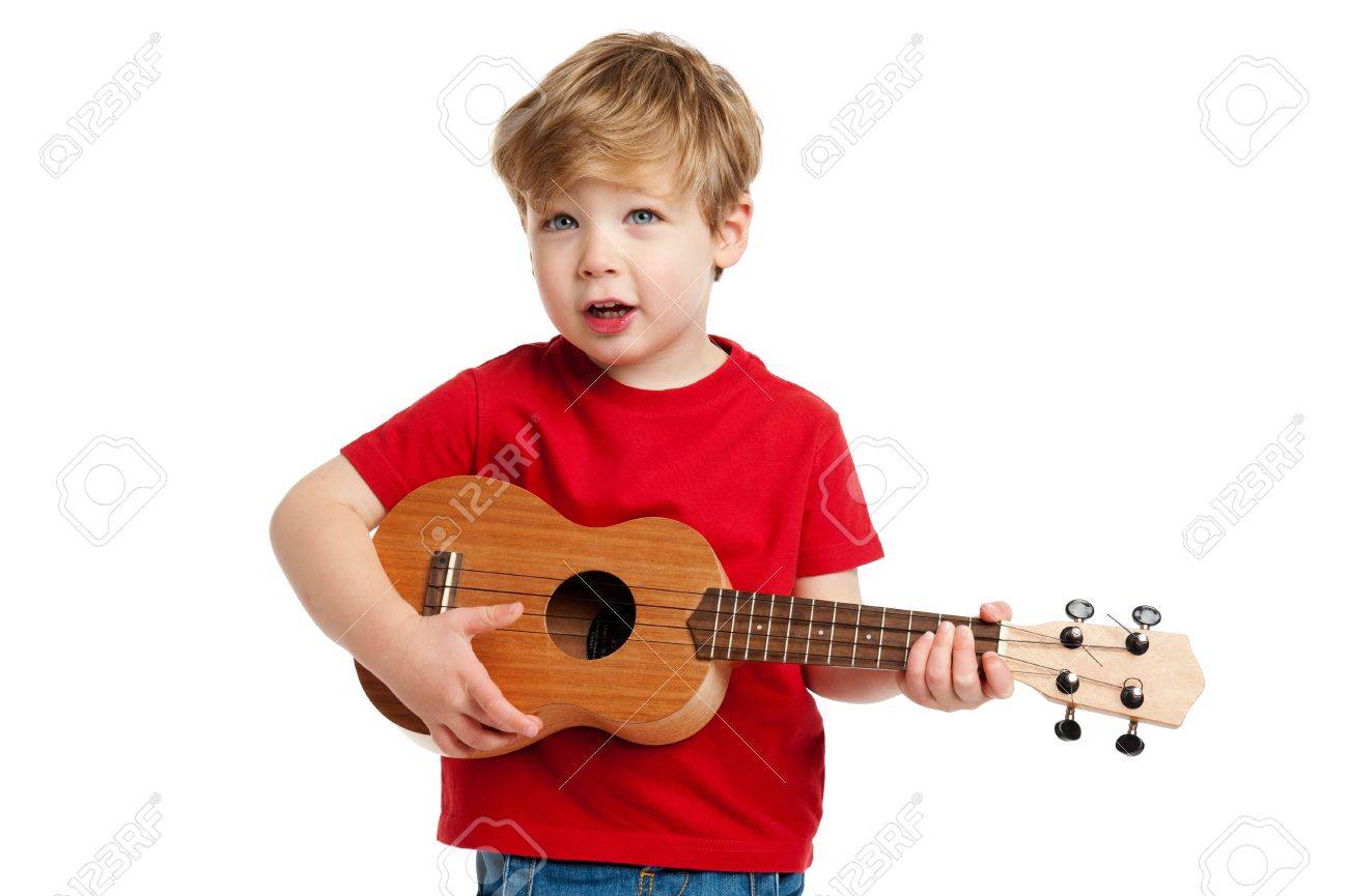 Boy singing and playing guitar shot in the studio on a white background - 19593275 Boy singing and playing guitar shot in the studio on a white background - 19593275