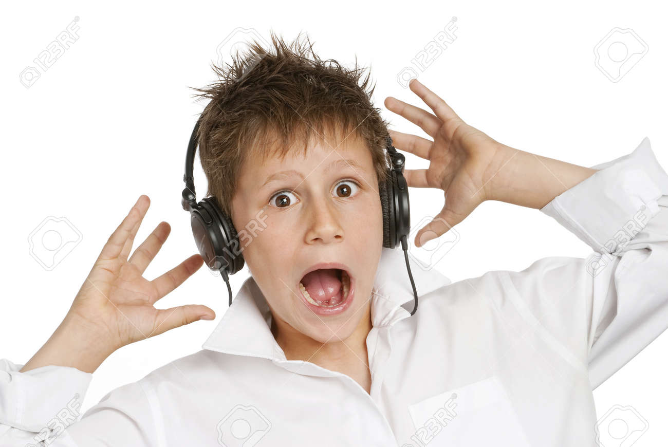 Boy with headphones, shocked and startled by loud noise - 19627926 Boy with headphones, shocked and startled by loud noise - 19627926
