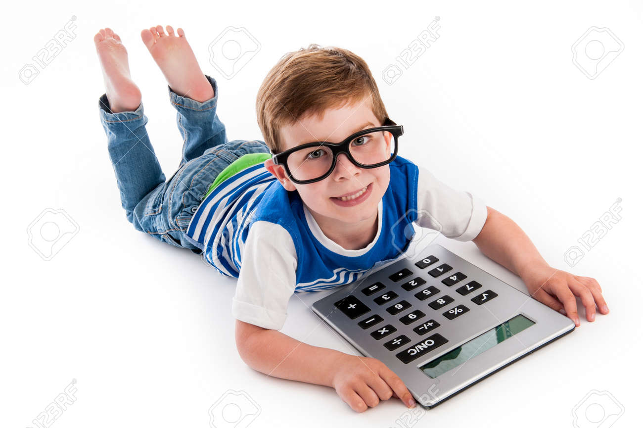 Geeky toddler boy lying on the floor with big calculator and big geeky glasses. Studio shot isolated on white. - 21509667