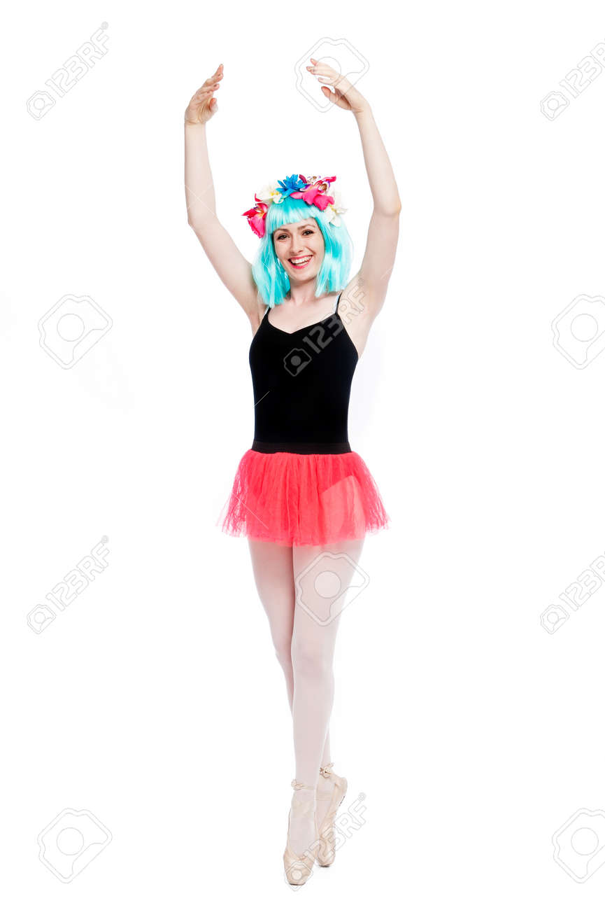 Smiling ballet girl in point position with arms up. Shot in studio on white background. - 40550081 Smiling ballet girl in point position with arms up. Shot in studio on white background. - 40550081