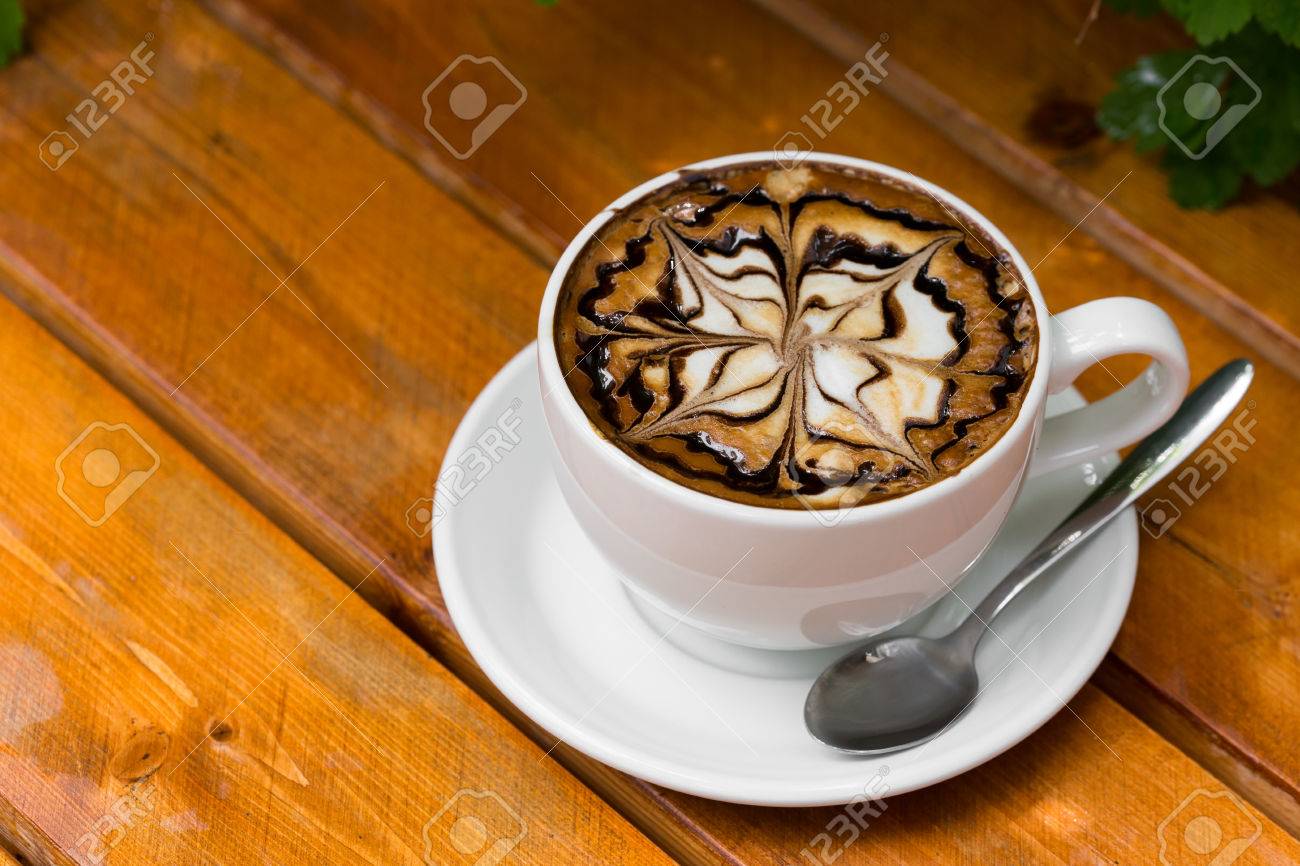 Coffee Cup Of Cappuccino Hot With Zigzag Caramel Motif Or Spiderweb Art Floating Coffee Cup Of Cappuccino Hot With Zigzag Caramel Motif Or Spiderweb Art Floating