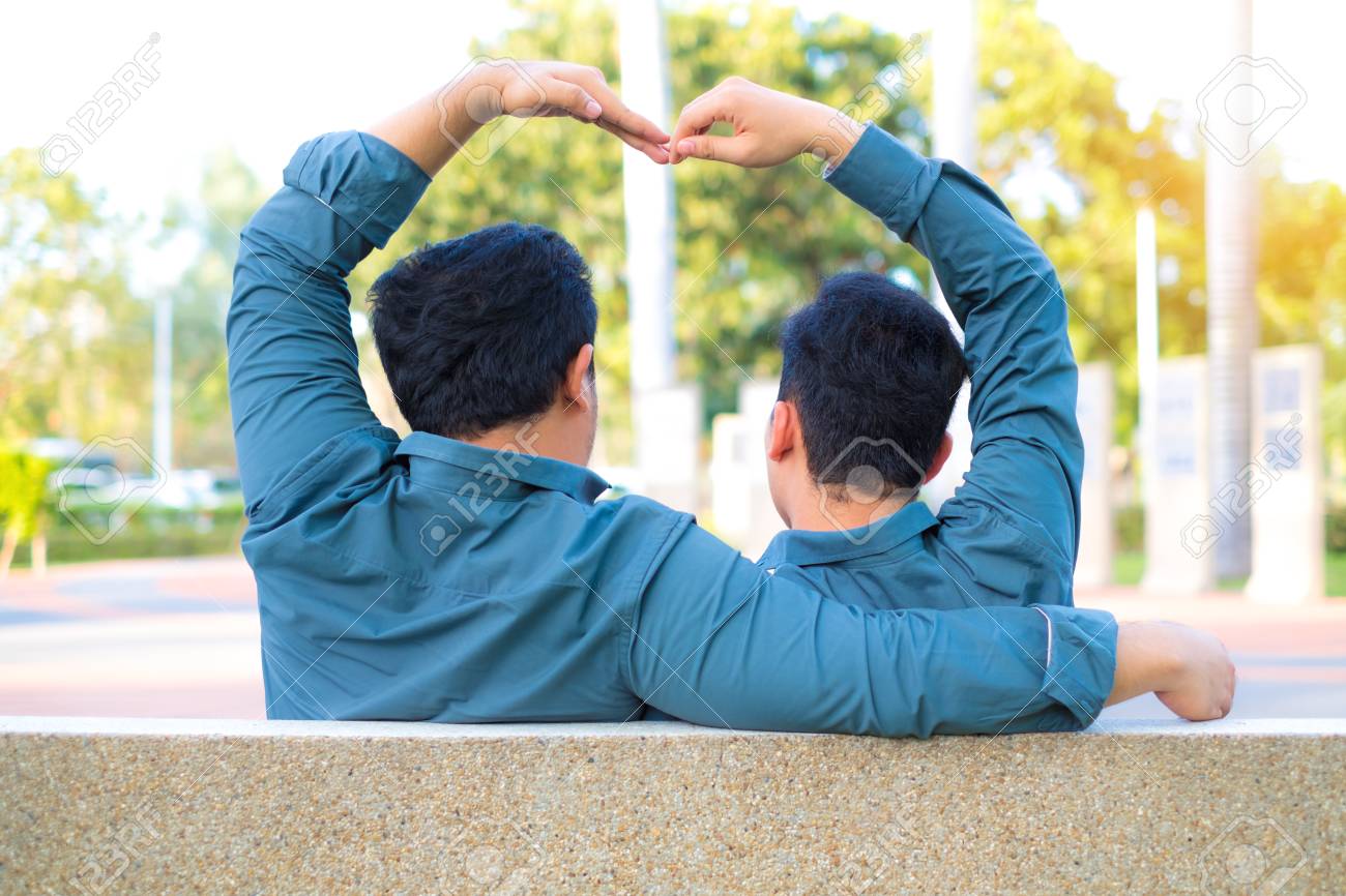 Asian Gay Couples Romantic Hand Made Heart-shaped Hand To Make Love  Happily. Stock Photo, Picture And Royalty Free Image. Image 97073517.