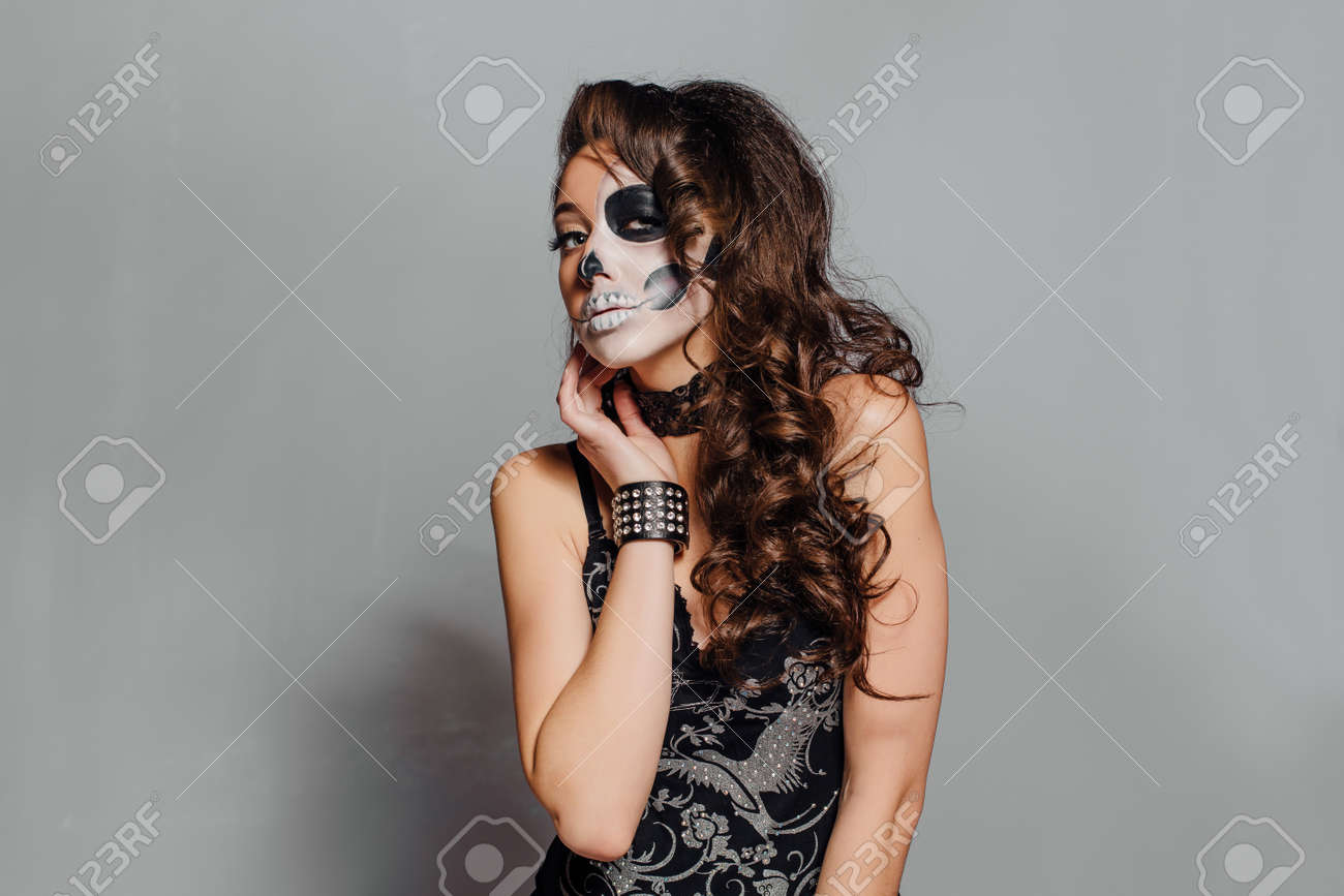Young Woman In Black With Half Face Skull Make Up Stock Photo Picture And Royalty Free Image Image