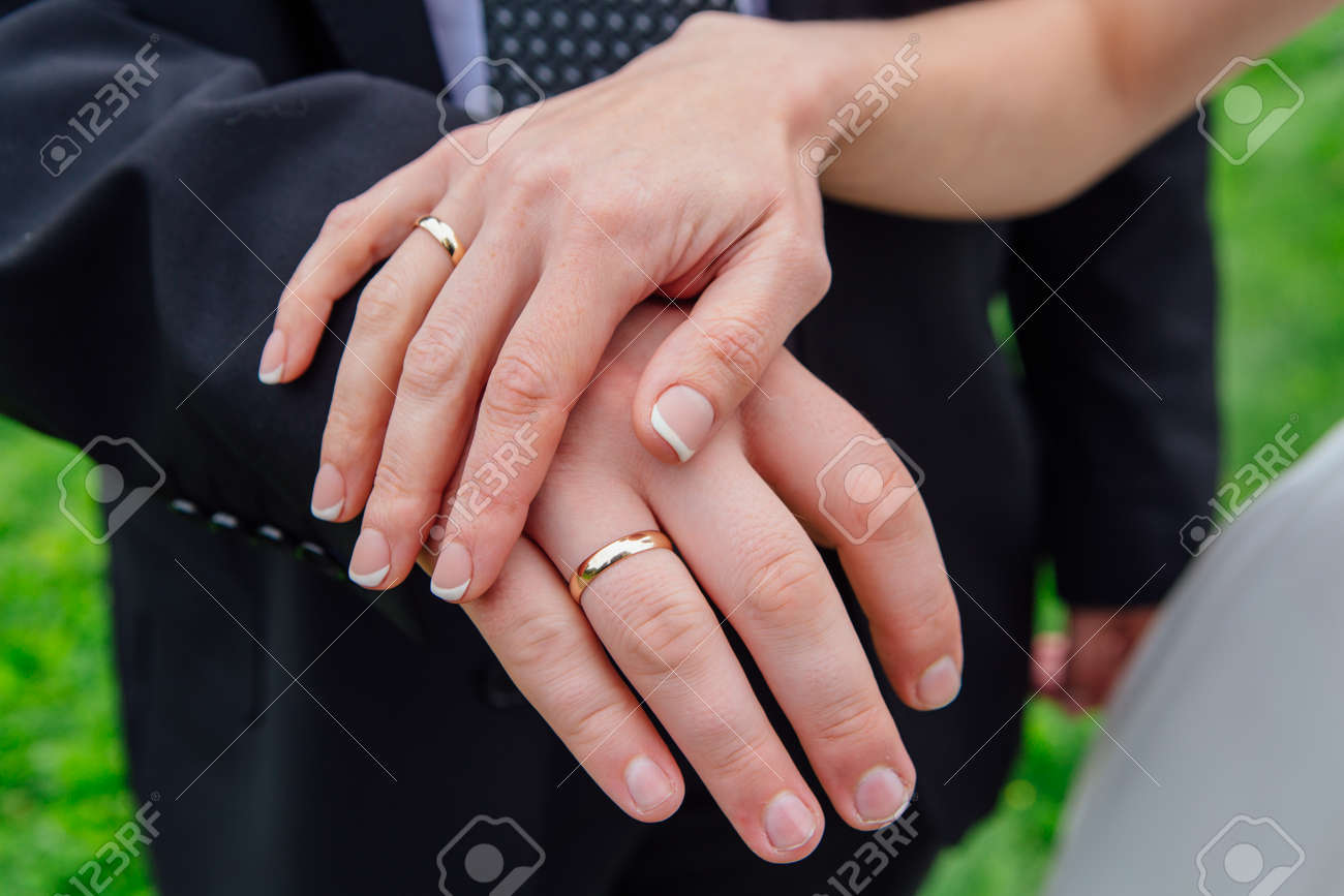 wedding rings on hands