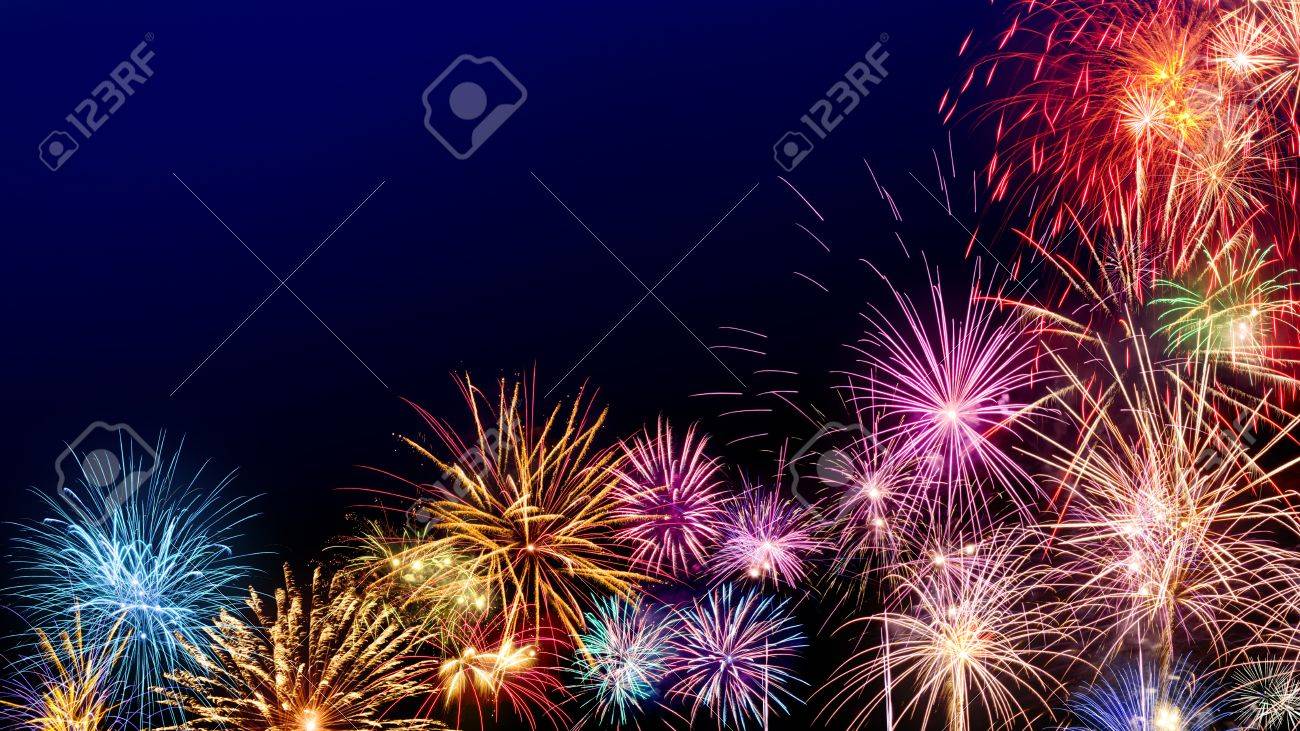 Multi-colored fireworks as a border on dark blue background, ideal for New Year or other celebration events - 69689447 Multi-colored fireworks as a border on dark blue background, ideal for New Year or other celebration events - 69689447