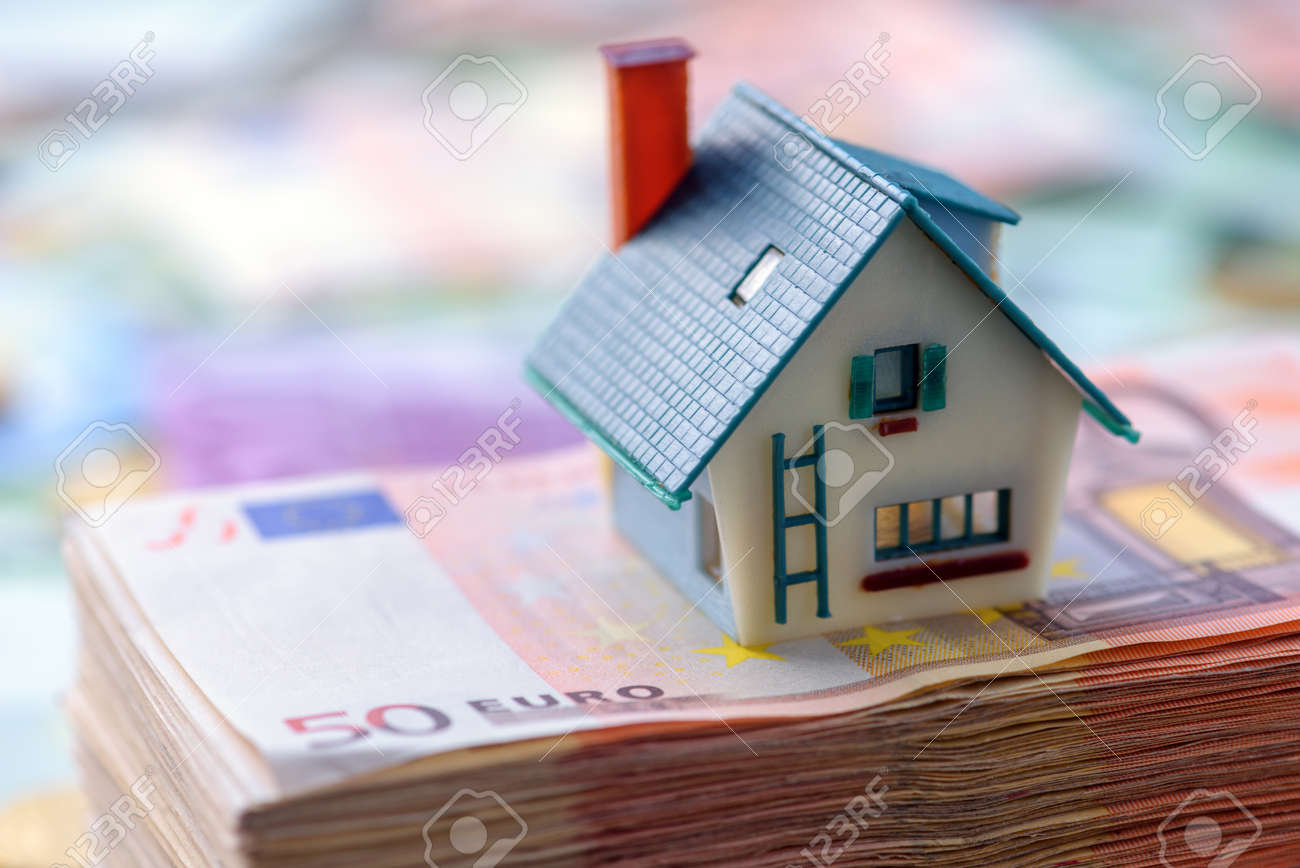 house model on euro cash stack closeup - 64387609 house model on euro cash stack closeup - 64387609