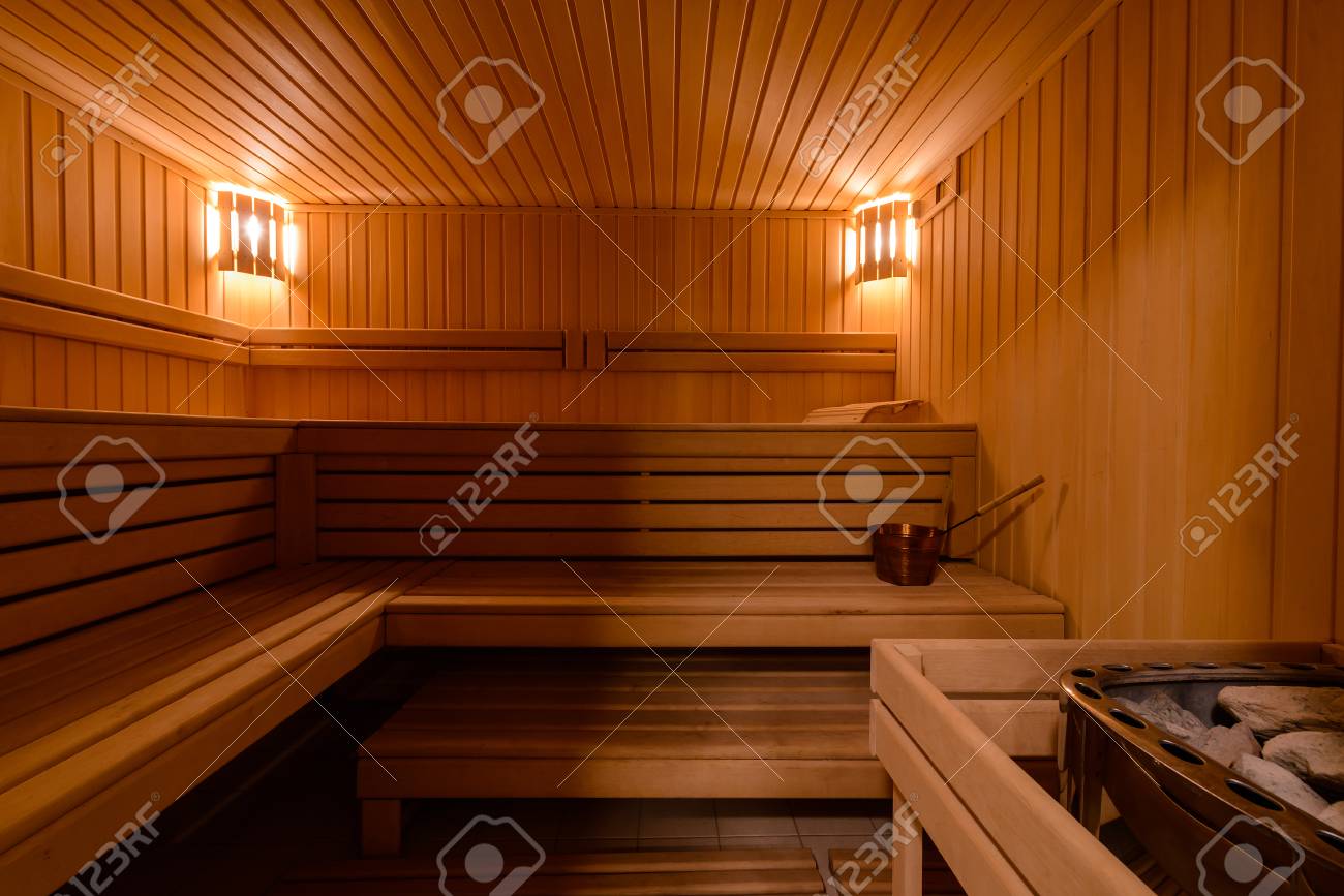 Sauna Room Interior As Background, Spa Room. Relax In A Hot Sauna, Finland-style Classic Wooden Sauna Interior In Public Building, Hotel. Small Home Finnish Wooden Sauna Stock Photo, Picture And Royalty Free