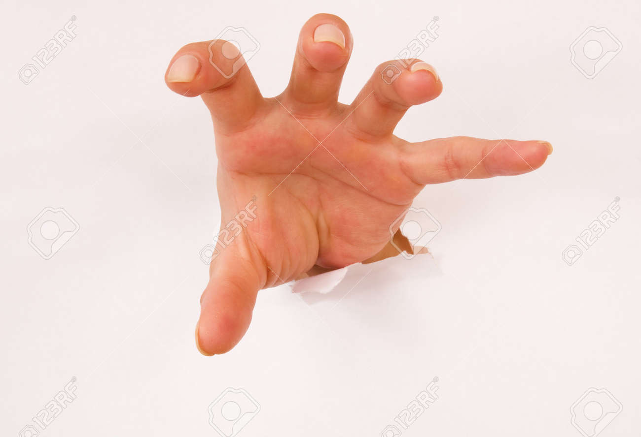 hand popping out of hole in flat white surface stock photo picture