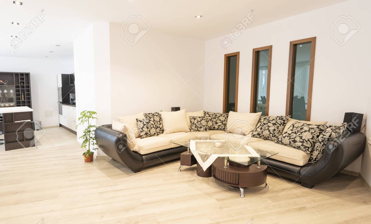 Open space living room with kitchen. New home. Room with white.. Open space living room with kitchen. New home. Room with white..