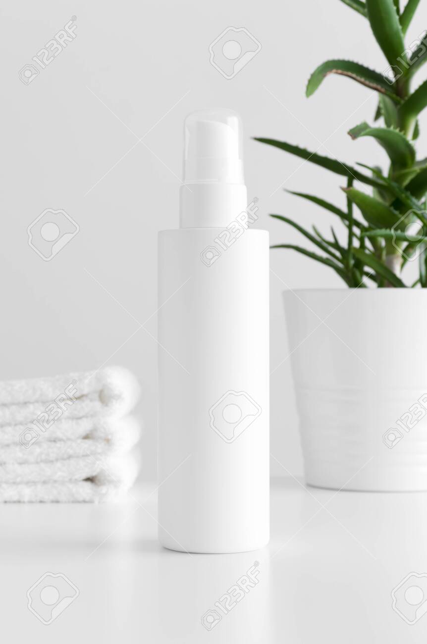Download White Cosmetic Lotion Bottle Mockup With A Aloe Vera And Towels Stock Photo Picture And Royalty Free Image Image 154506209