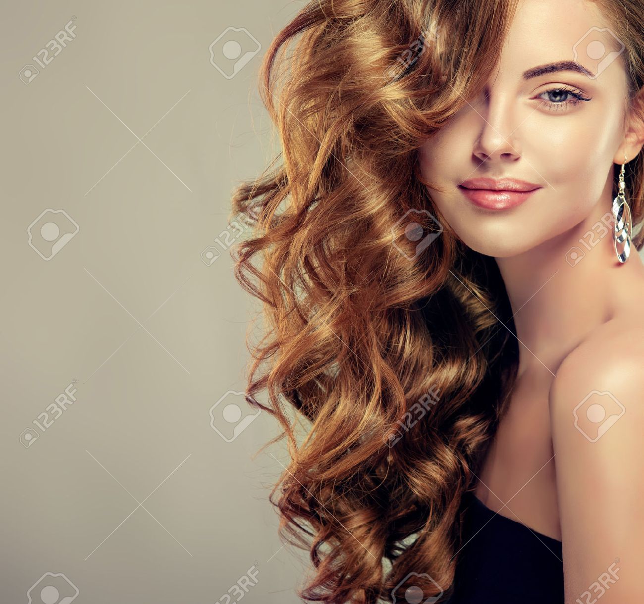 Beautiful girl with long wavy hair . Brunette model with curly hairstyle - 53032295 Beautiful girl with long wavy hair . Brunette model with curly hairstyle - 53032295