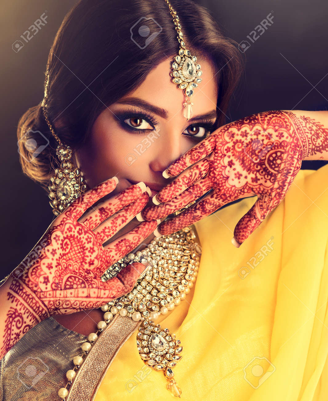 Beautiful indian girl . Young hindu woman model with tatoo mehndi..
