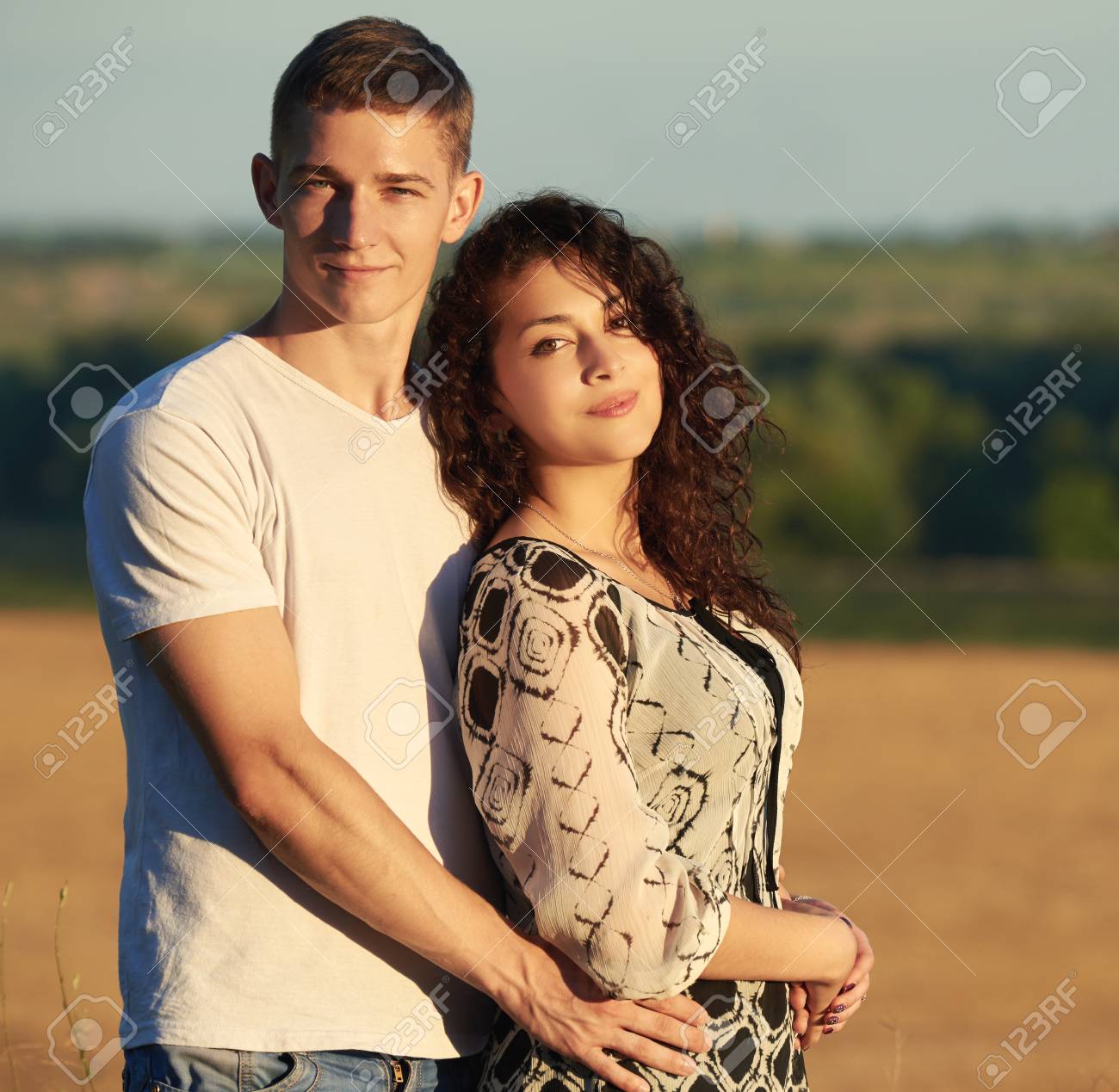 Young Couple Posing Outdoor On Wooden Stock Photo 125015486 | Shutterstock