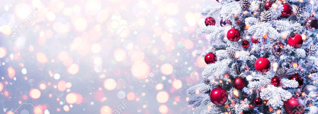 Abstract Holiday Background - Snowy Christmas Tree With Red Baubles With Shiny Defocused Lights - 159435969 Abstract Holiday Background - Snowy Christmas Tree With Red Baubles With Shiny Defocused Lights - 159435969