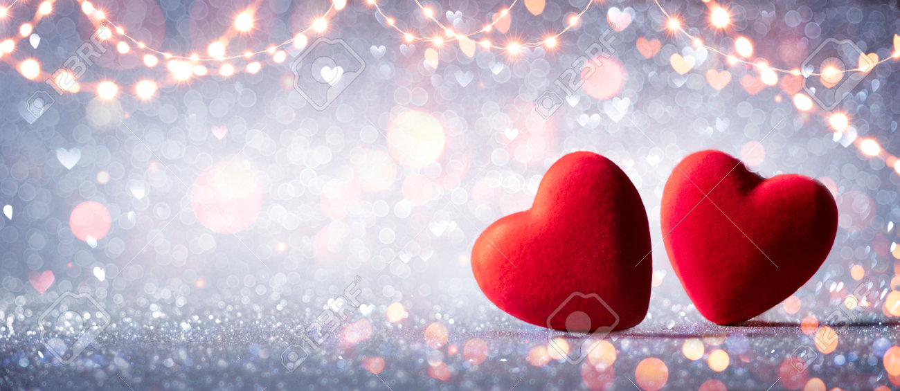 Two Hearts In Love On Silver Glitter With Abstract Defocused Background - 162813982 Two Hearts In Love On Silver Glitter With Abstract Defocused Background - 162813982