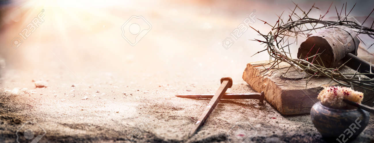 Passion Of Jesus Christ - Hammer And Bloody Nails And Crown Of Thorns On Arid Ground With Defocused Background - 167156663 Passion Of Jesus Christ - Hammer And Bloody Nails And Crown Of Thorns On Arid Ground With Defocused Background - 167156663