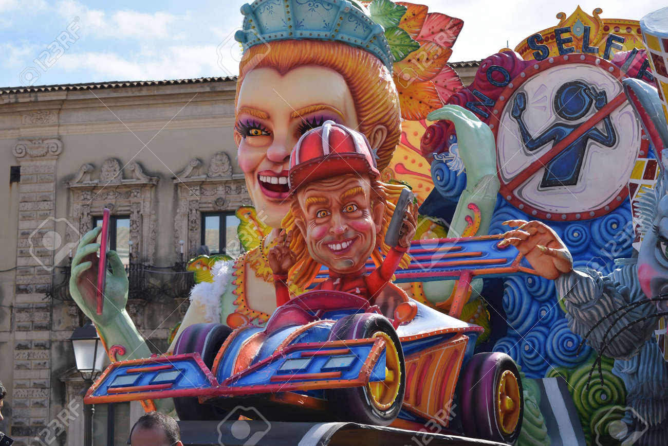 Acireale (CT), Italy - February 16, 2020: detail of a allegorical float depicting a race car driver during the carnival parade along the streets of Acireale. - 141805575 Acireale (CT), Italy - February 16, 2020: detail of a allegorical float depicting a race car driver during the carnival parade along the streets of Acireale. - 141805575