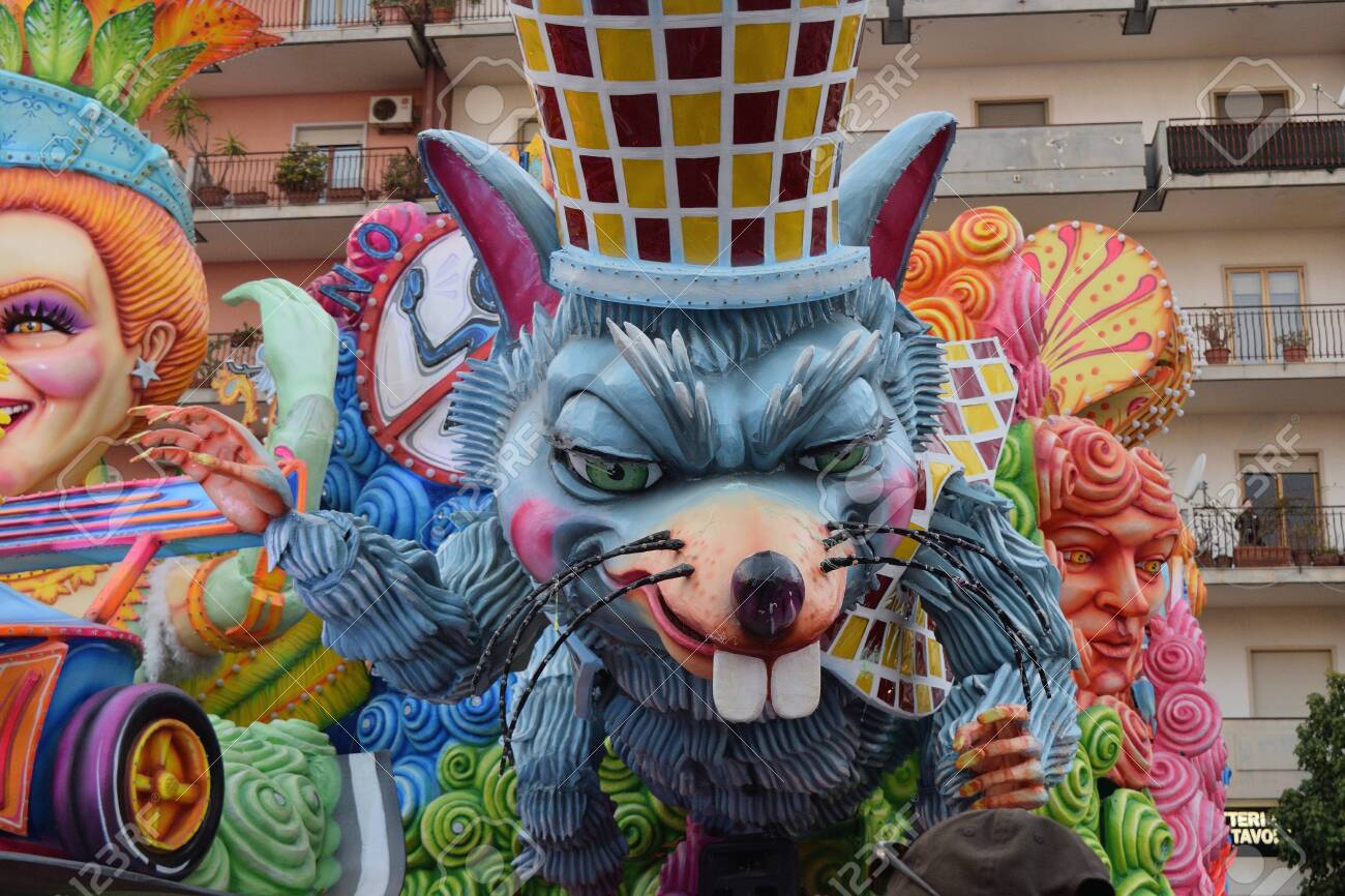 Acireale (CT), Italy - February 16, 2020: detail of a allegorical float depicting a mouse during the carnival parade along the streets of Acireale. - 141805606 Acireale (CT), Italy - February 16, 2020: detail of a allegorical float depicting a mouse during the carnival parade along the streets of Acireale. - 141805606