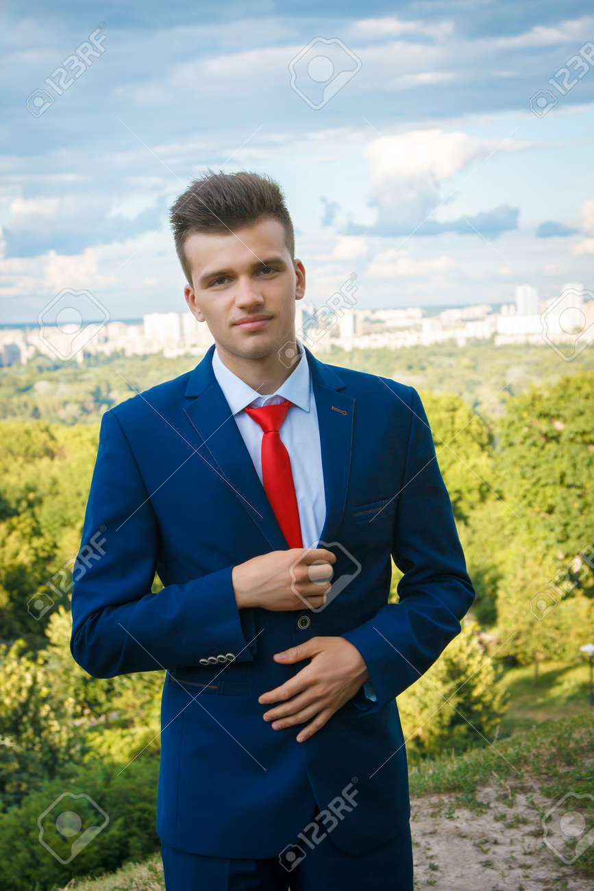 white tie white shirt blue suit