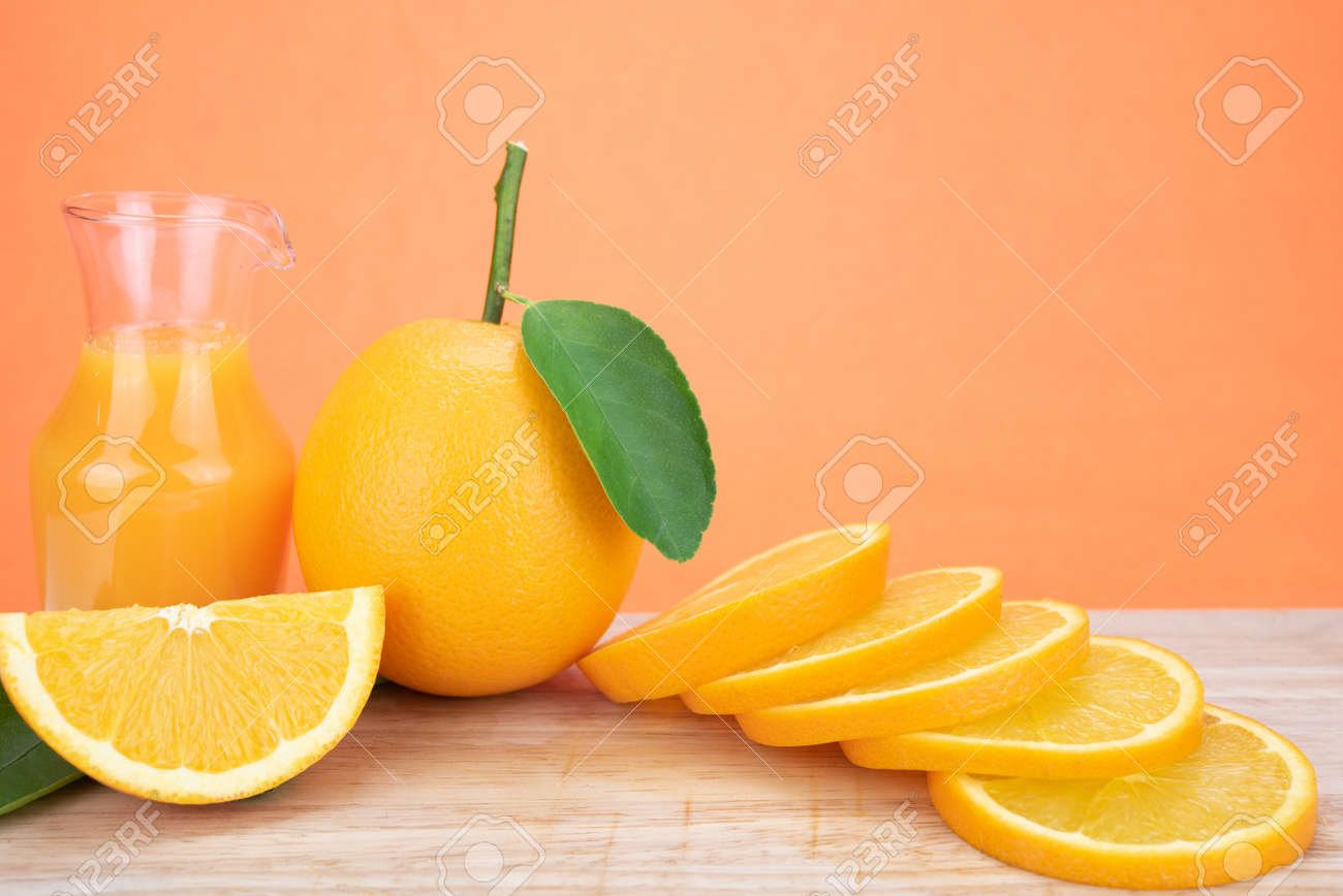 Glass Of Fresh Orange Juice With Group Of Orange On Orange Color Stock Photo Picture And Royalty Free Image Image