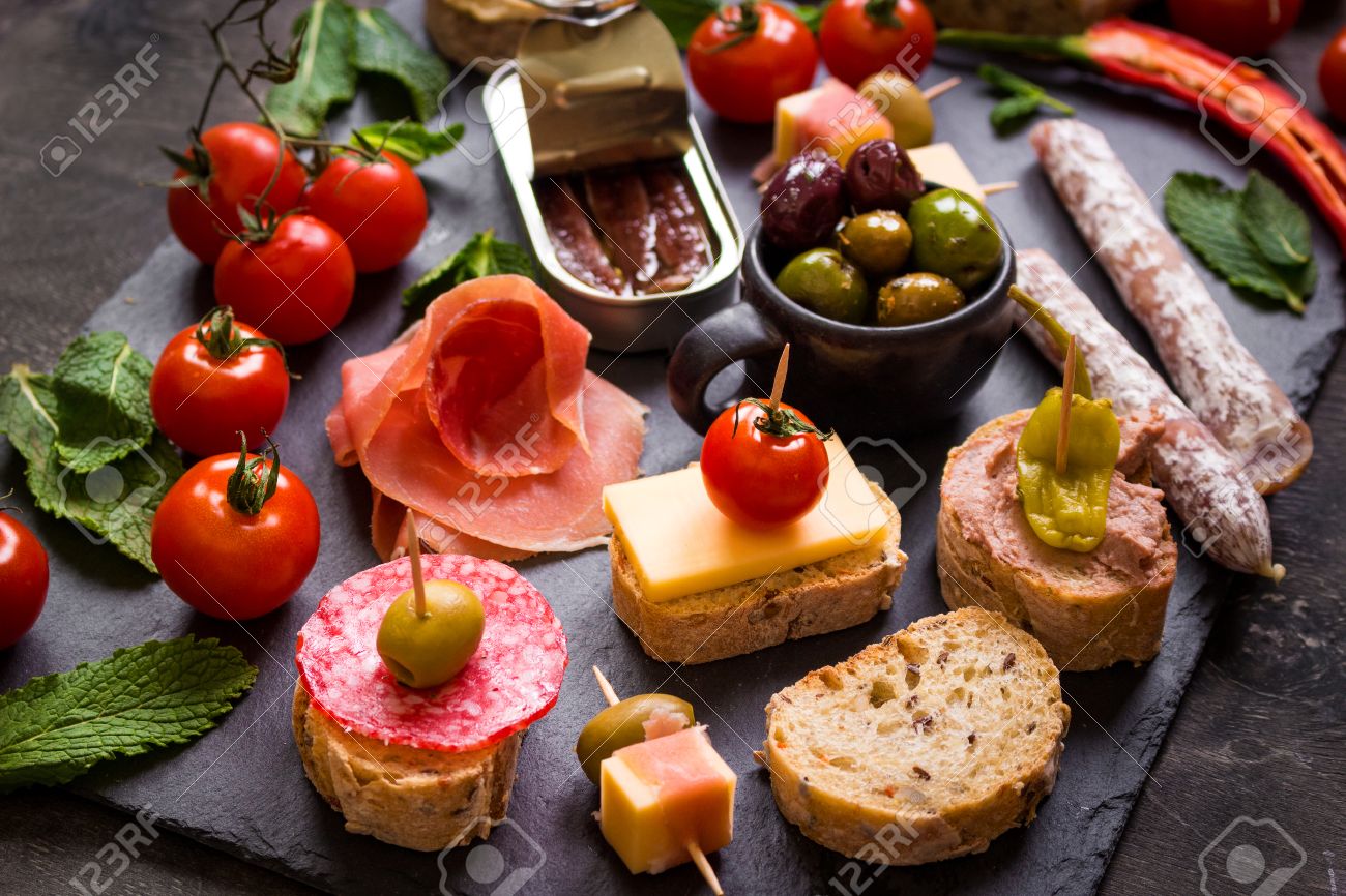 Mix Of Different Snacks And Appetizers Spanish Tapas On A Black Stock Photo Picture And Royalty Free Image Image 58767157