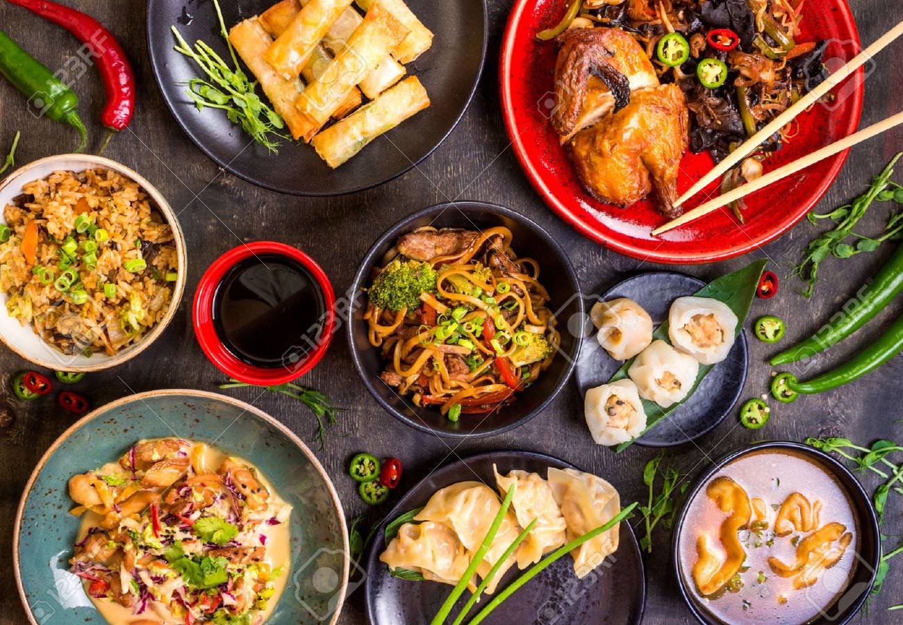 Assorted Chinese food set. Chinese noodles, fried rice, dumplings, peking duck, dim sum, spring rolls. Famous Chinese cuisine dishes on table. Top view. Chinese restaurant concept. Asian style banquet - 62444805 Assorted Chinese food set. Chinese noodles, fried rice, dumplings, peking duck, dim sum, spring rolls. Famous Chinese cuisine dishes on table. Top view. Chinese restaurant concept. Asian style banquet - 62444805