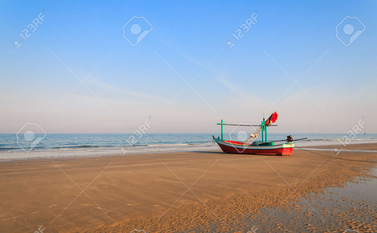 Fishing Boat Waiting On The Beach For High Tide Hua Hin Thailand