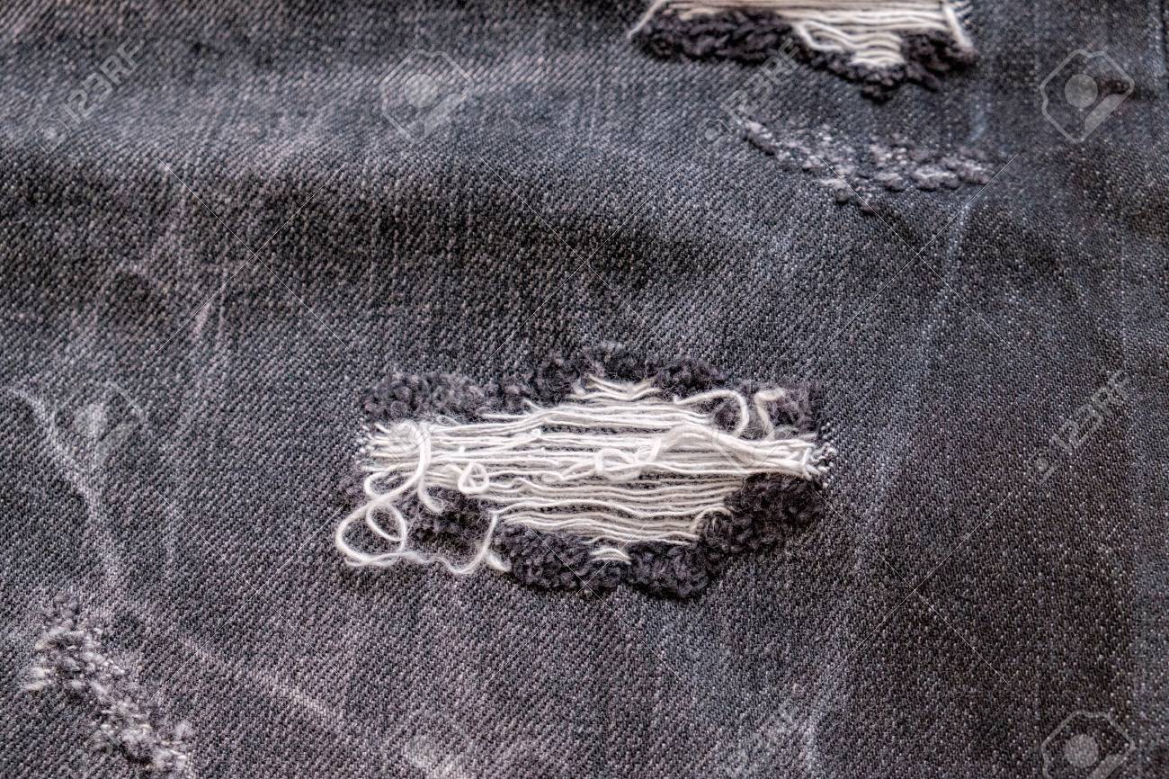 ripped up black jeans