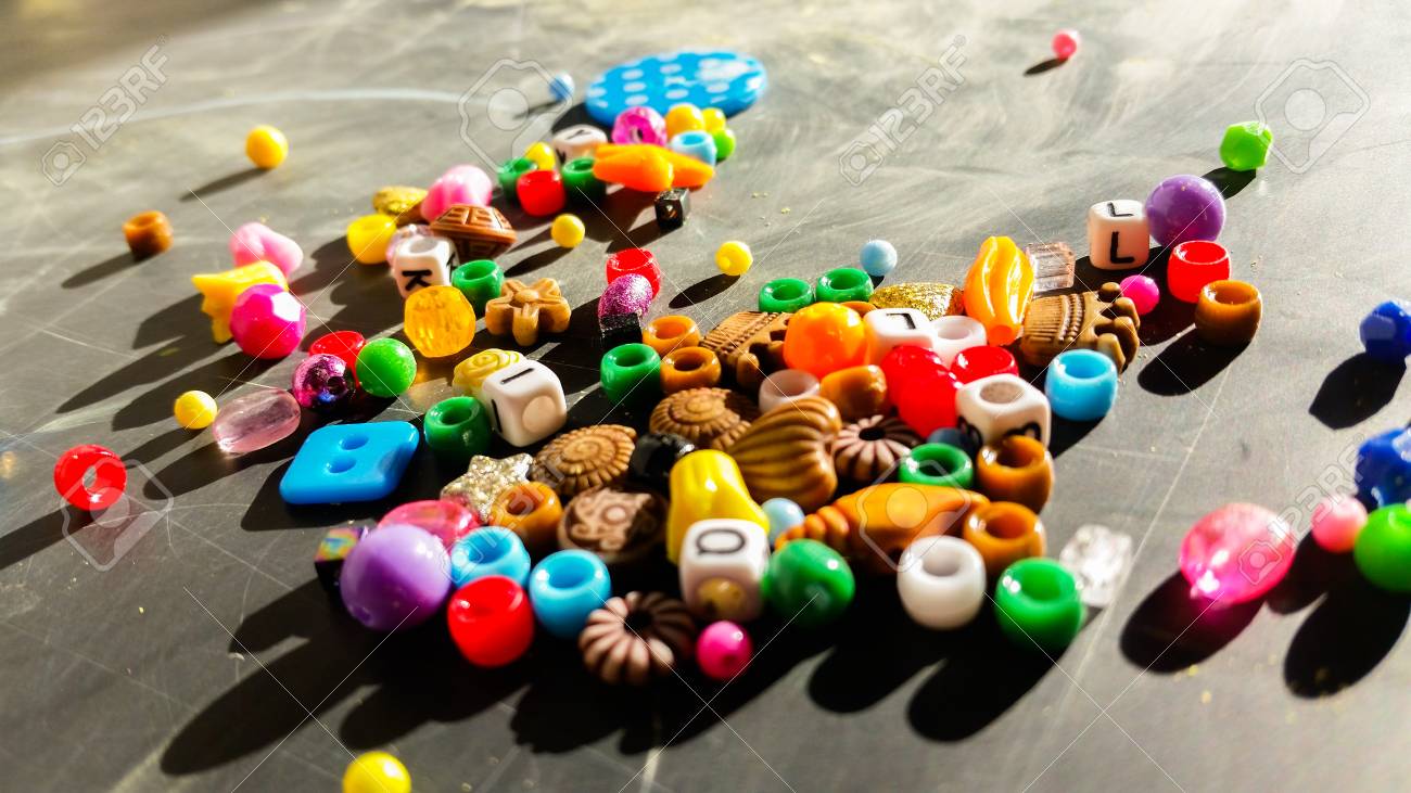 Colored beads are used to make bracelets and necklaces - 92883039 Colored beads are used to make bracelets and necklaces - 92883039