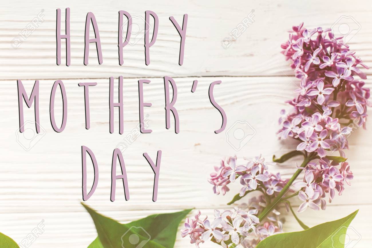 Happy Mothers Day Beautiful Ladies Happy Mother's Day Text Sign, Simple Greeting Card. Happy Mothers Day.  Beautiful Lilac Flowers On Rustic