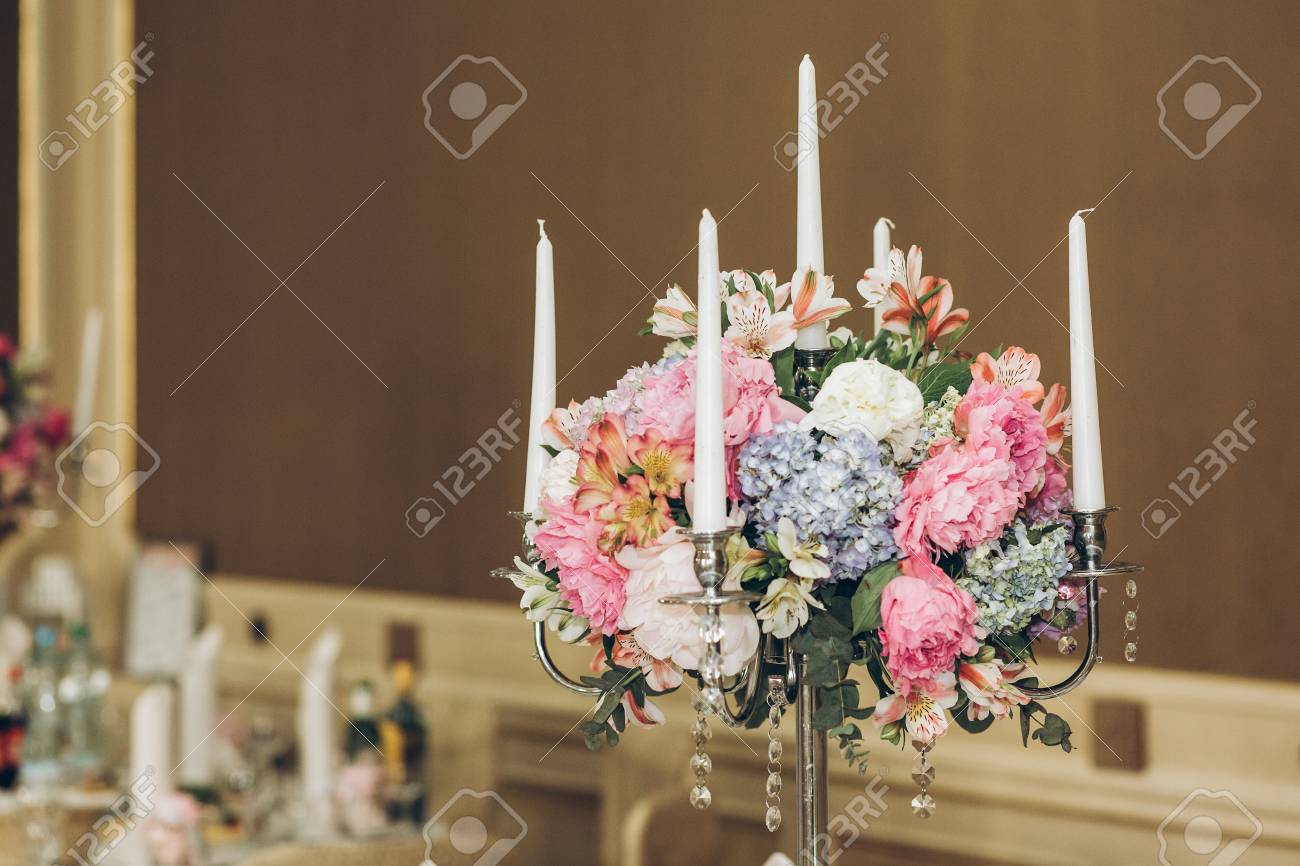 Beautiful Hydrangea Bouquets In Vases And Shiny Silver Candelabras