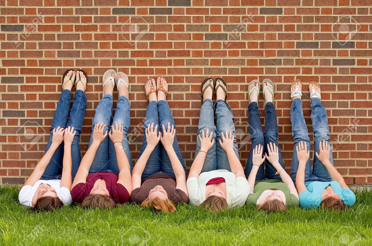 Group of College Girls at School With Legs up on Wall - 5931373 Group of College Girls at School With Legs up on Wall - 5931373