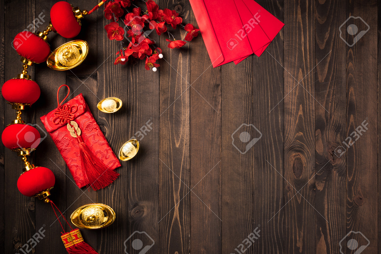 Chinese new year 2021 festival, Top view flat lay lunar new year or Happy Chinese new year decorations celebration with copy space on the wood background (Chinese character "fu" meaning fortune) - 160643856 Chinese new year 2021 festival, Top view flat lay lunar new year or Happy Chinese new year decorations celebration with copy space on the wood background (Chinese character "fu" meaning fortune) - 160643856