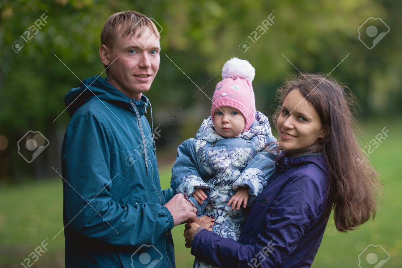 Happy Family Father Mother And Child Little Girl In Autumn Park Dad Mammy Baby Posing Outdoor Close Up Telephoto Shot Stock Photo Picture And Royalty Free Image Image