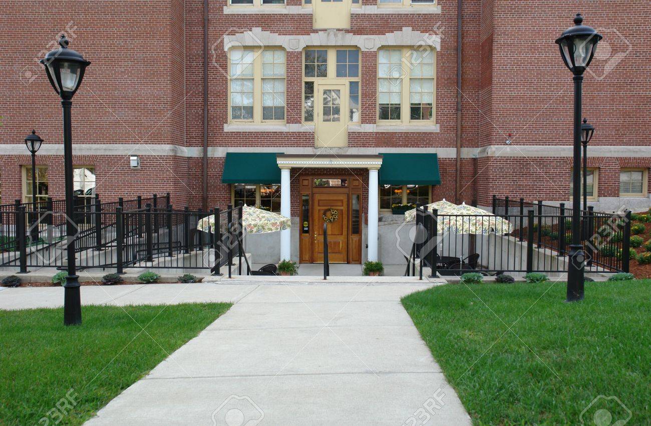 Apartment Building Entry shows front entry to apartment building with old fashioned street Apartment Building Entry shows front entry to apartment building with old fashioned street