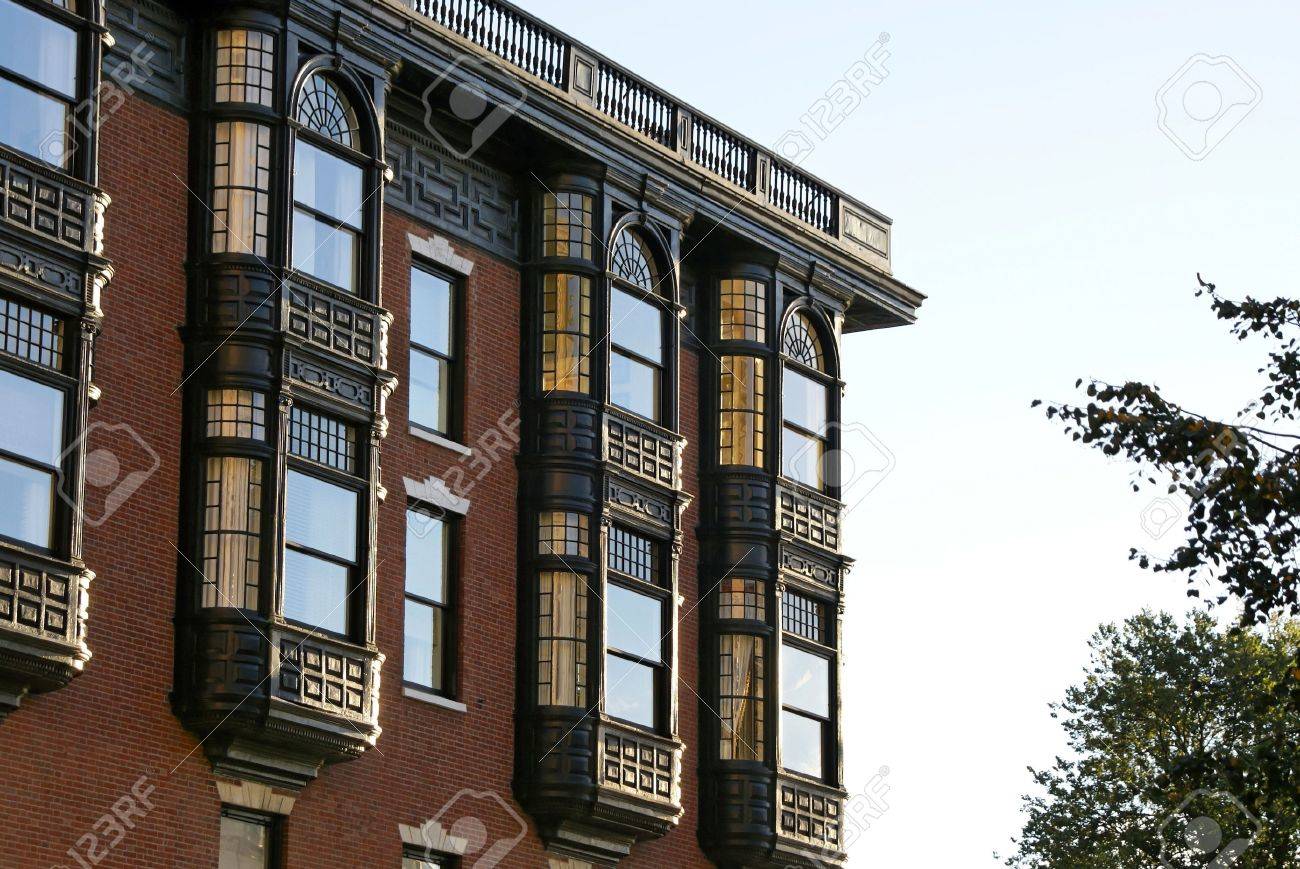 Upper Floors Of Old Brownstone Apartment Building In Boston Massachusetts On A Fall Afternoon Upper Floors Of Old Brownstone Apartment Building In Boston Massachusetts On A Fall Afternoon