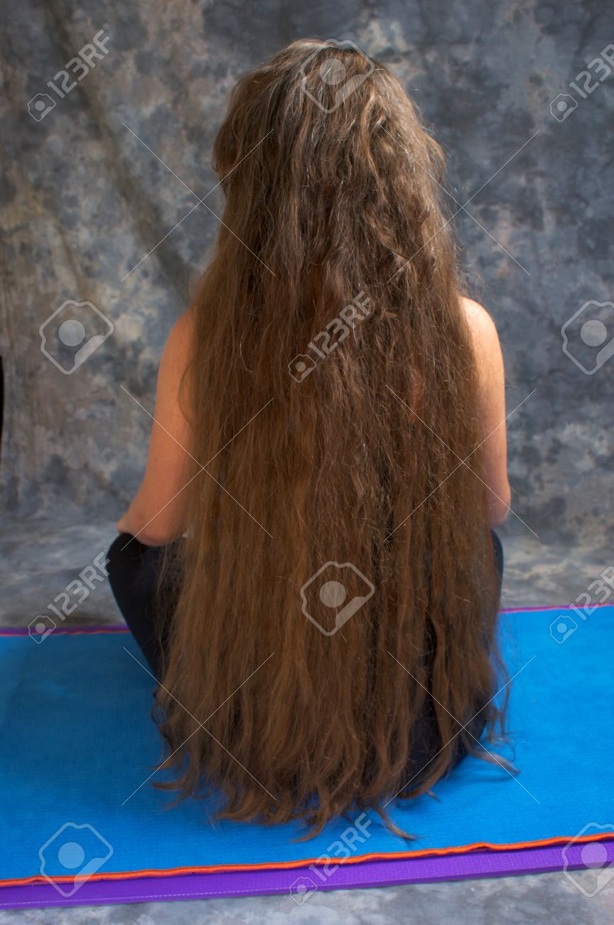 Back View Of A Woman With Long Messy Hair Down To Her Waist And