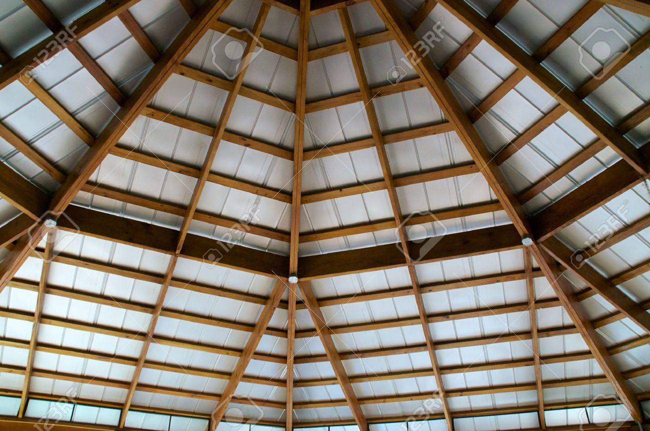 An Exposed Beam Ceiling Is Covered With A Tin Roof Seen From