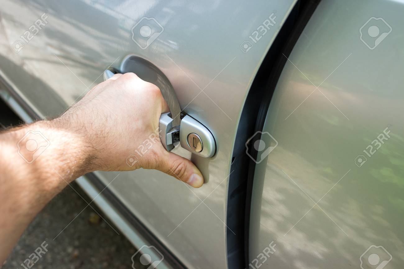 car door handle hand hand on handle closeup of man opening a90 car