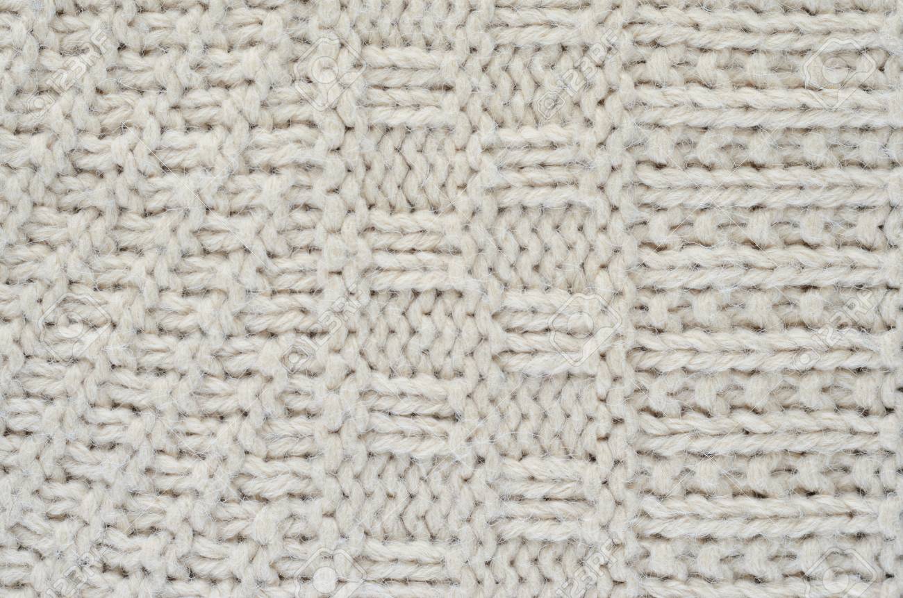 ニットのセーターのテクスチャは 厚いベージュ文字列です さまざまな種類のパターンのクローズ アップのセーターの一部 の写真素材 画像素材 Image
