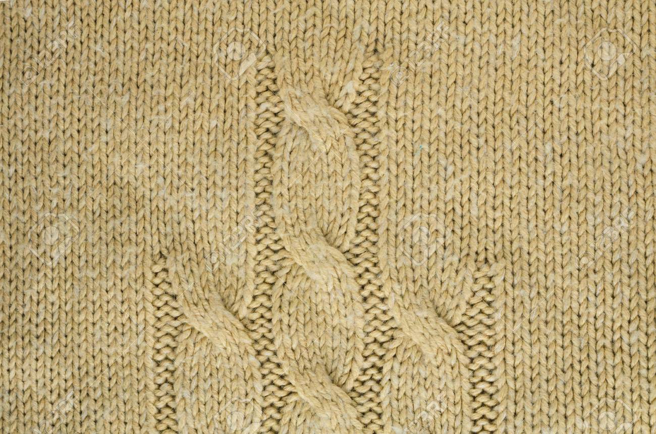 Knit Texture Of Beige Wool Knitted Fabric With Cable Knits Pattern Knit Texture Of Beige Wool Knitted Fabric With Cable Knits Pattern