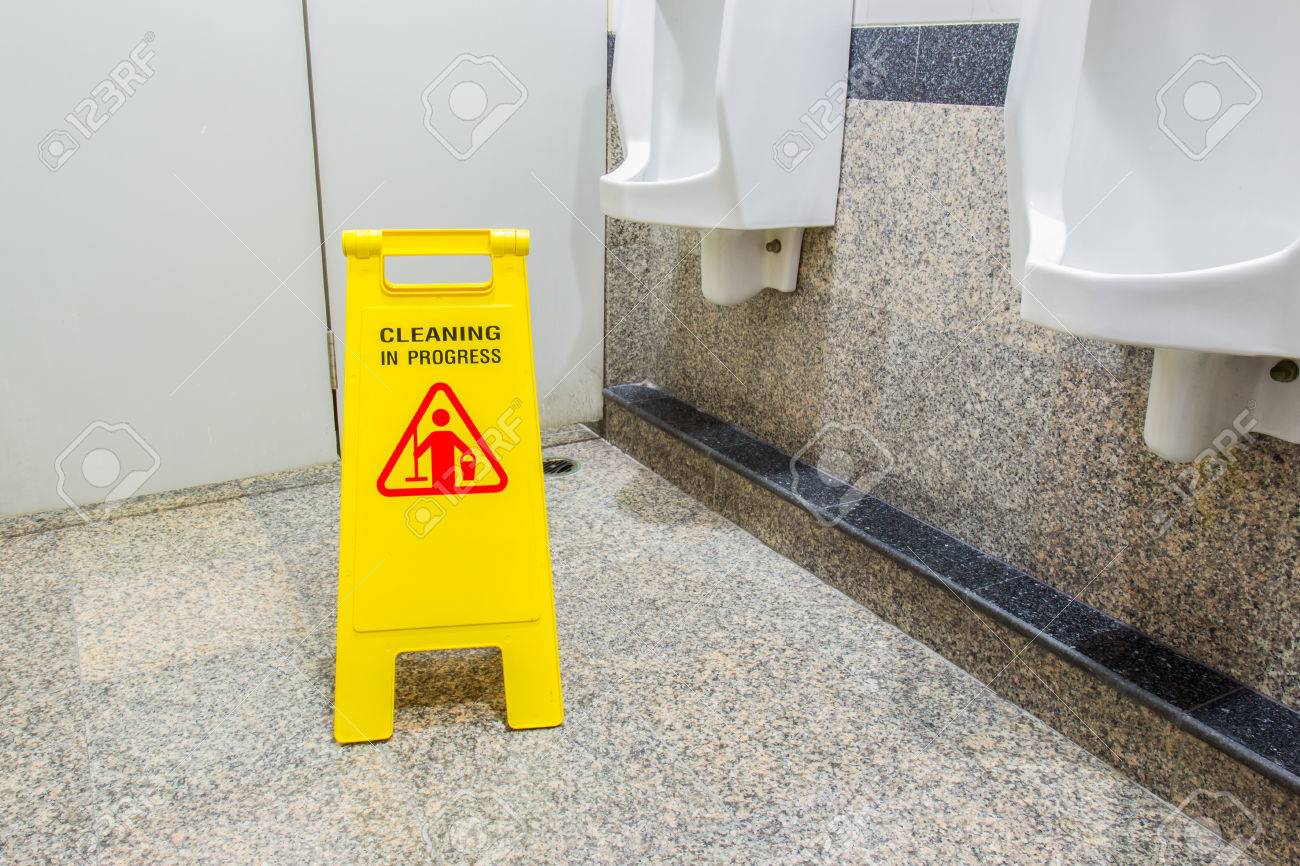 Toilet floor with mop bucket and "caution cleaning progress" signs, selective focus sign on the front. - 57957389 Toilet floor with mop bucket and "caution cleaning progress" signs, selective focus sign on the front. - 57957389