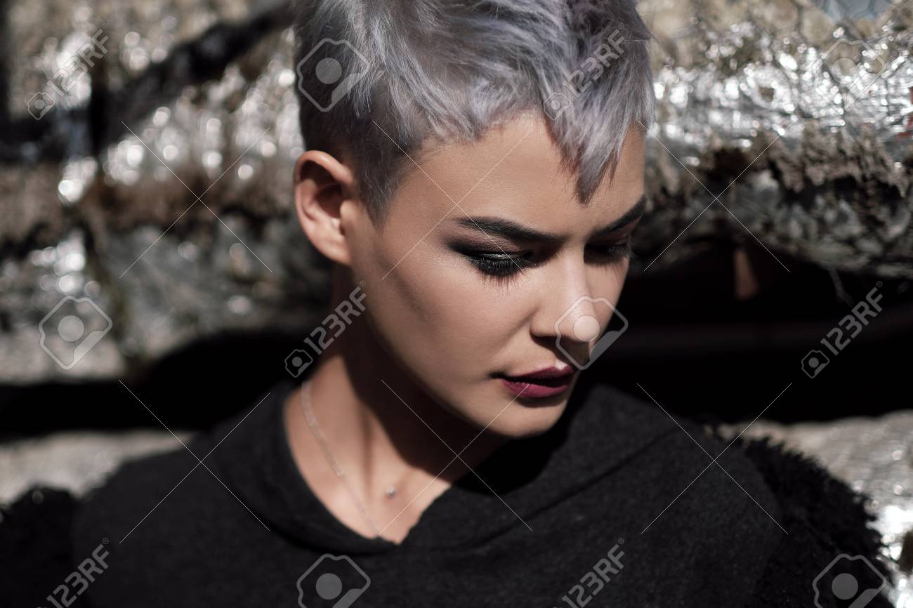Young Beautiful Girl With Short Gray Hair In A Black Jacket And