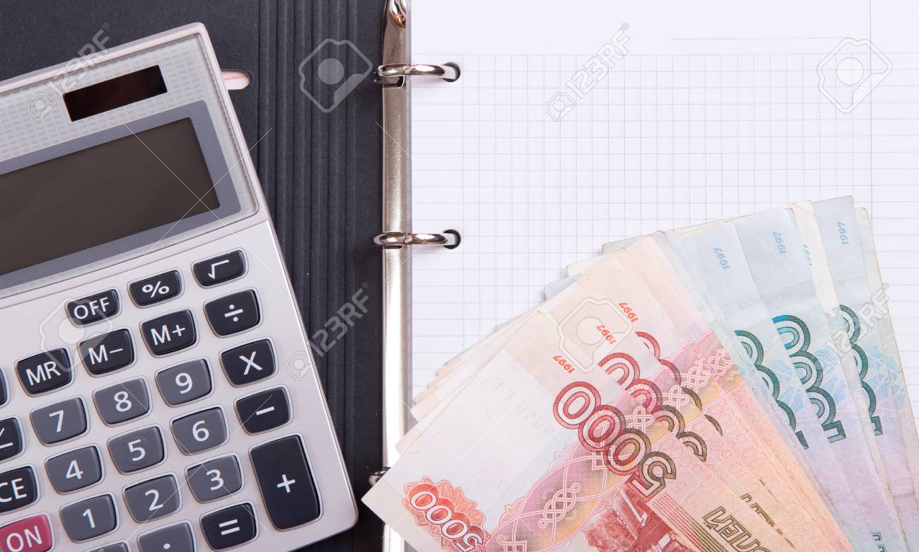 money calculator and blank notepad with copy space home budget budget money calculator