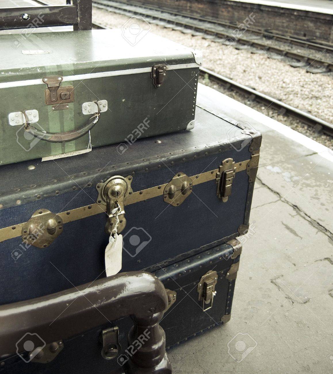 Old-fashioned personal baggage stacked up on train platform - 5743746 Old-fashioned personal baggage stacked up on train platform - 5743746