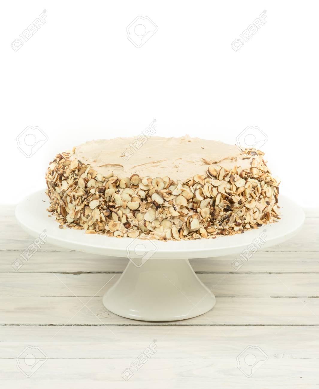 Cake With Almonds And Nougat Creme On A Wooden Table Stock Photo Picture And Royalty Free Image Image