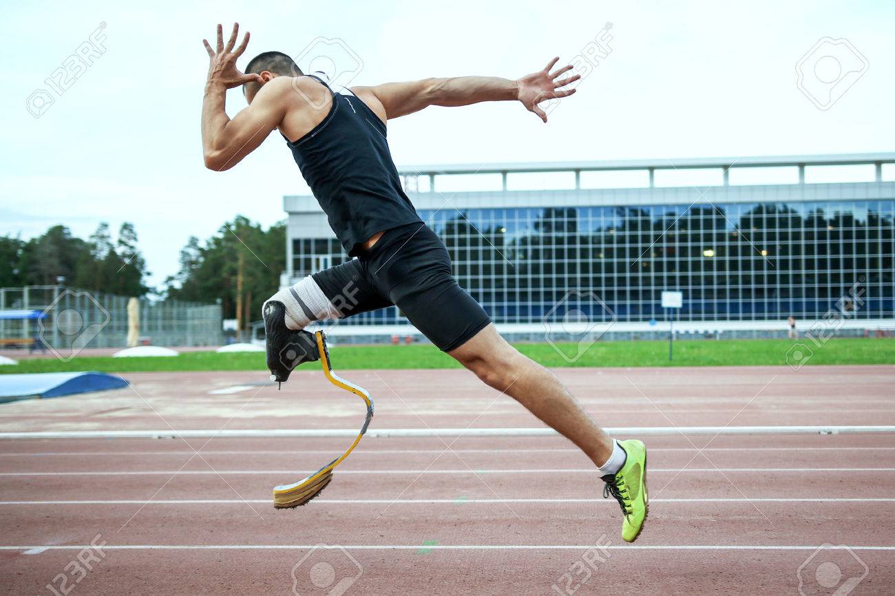 Explosive start of athlete with handicap at the stadium - 45346619 Explosive start of athlete with handicap at the stadium - 45346619