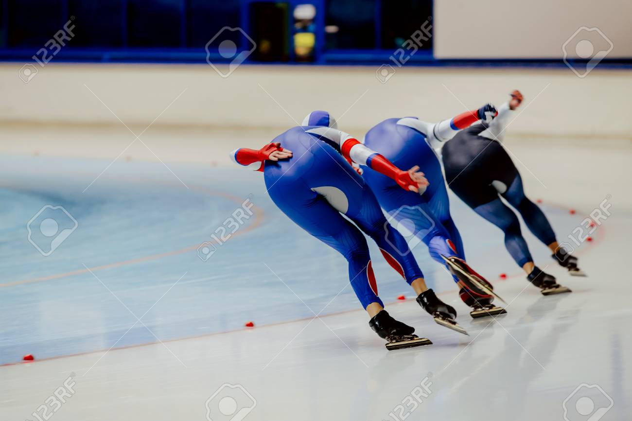 Back three women athletes speed skaters in warm-up - 90453302 Back three women athletes speed skaters in warm-up - 90453302